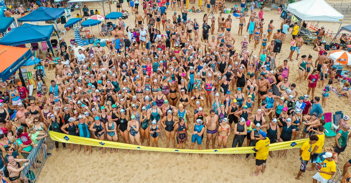How do I determine how many rooms I should build? - Drone view of crowded beach with people dressed in swimsuits standing behind tape ready for swim competition How do I determine how many rooms I should build? - Drone view of crowded beach with people dressed in swimsuits standing behind tape ready for swim competition
