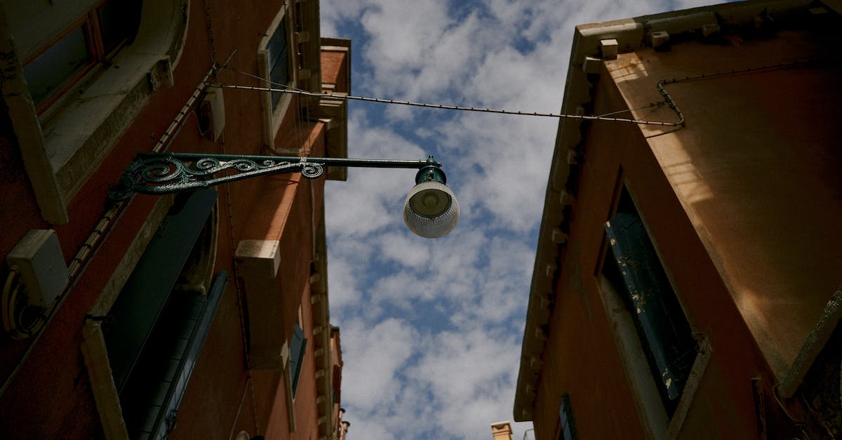 How do I disable players from building/placing blocks in a certain area of minecraft server? - From below exteriors of low rise apartment buildings in old town district under blue sky