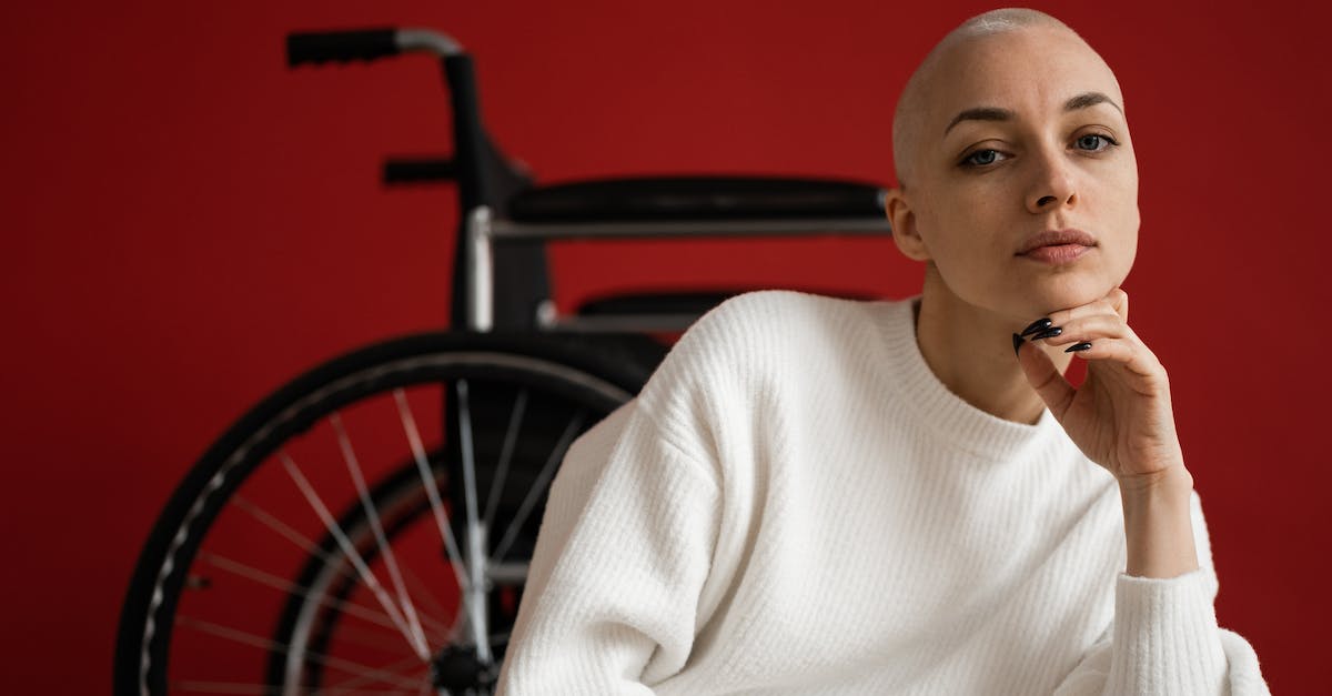 How do I disable the fog? - Woman with shaved head against wheelchair on red background How do I disable the fog? - Woman with shaved head against wheelchair on red background