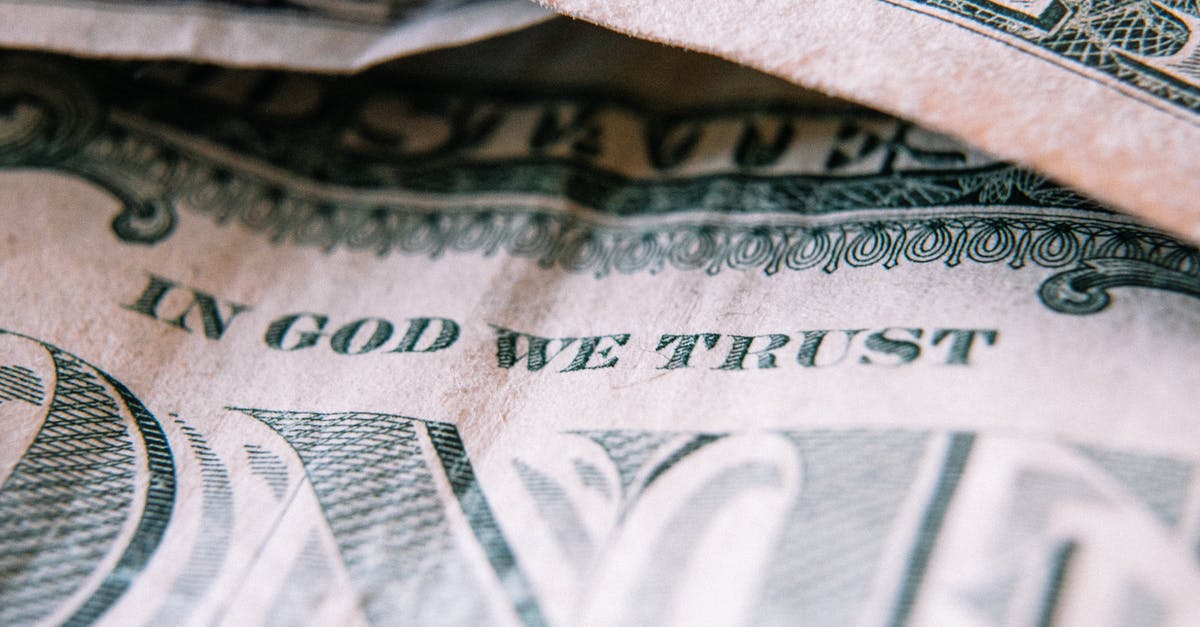 How do I earn credits? - One dollar banknotes placed on table How do I earn credits? - One dollar banknotes placed on table