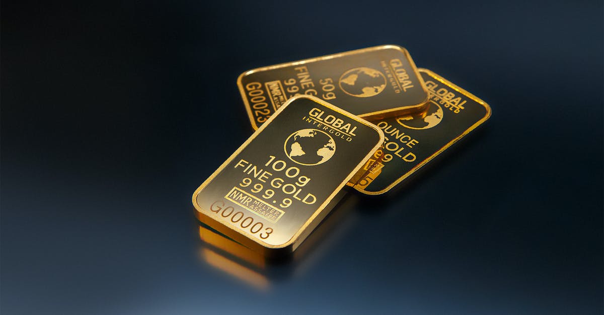 How do I earn or buy gold bars in Online? - Three Gold Bars Against Dark Background