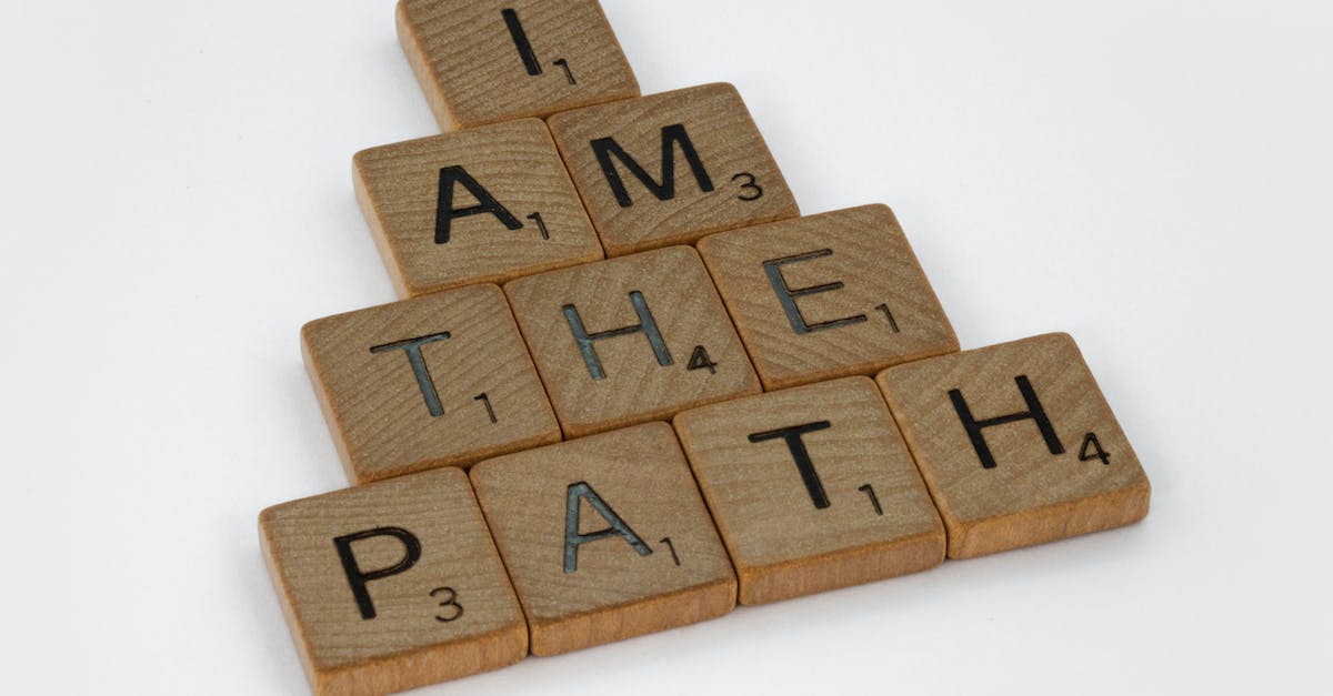 How do I earn the "I am a genius!" Achievement? - Close-Up Shot of Scrabble Tiles on a White Surface How do I earn the "I am a genius!" Achievement? - Close-Up Shot of Scrabble Tiles on a White Surface