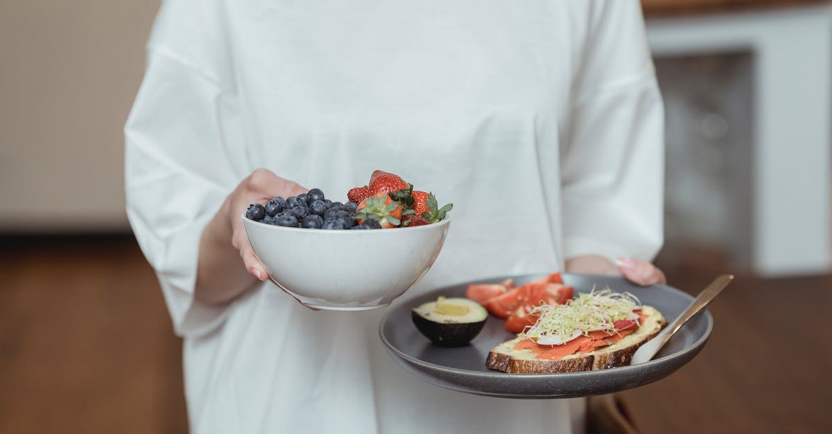 How do I enable GregTech Plate recepies? - Person Holding White Ceramic Bowl With Sliced Strawberries and Blueberries
