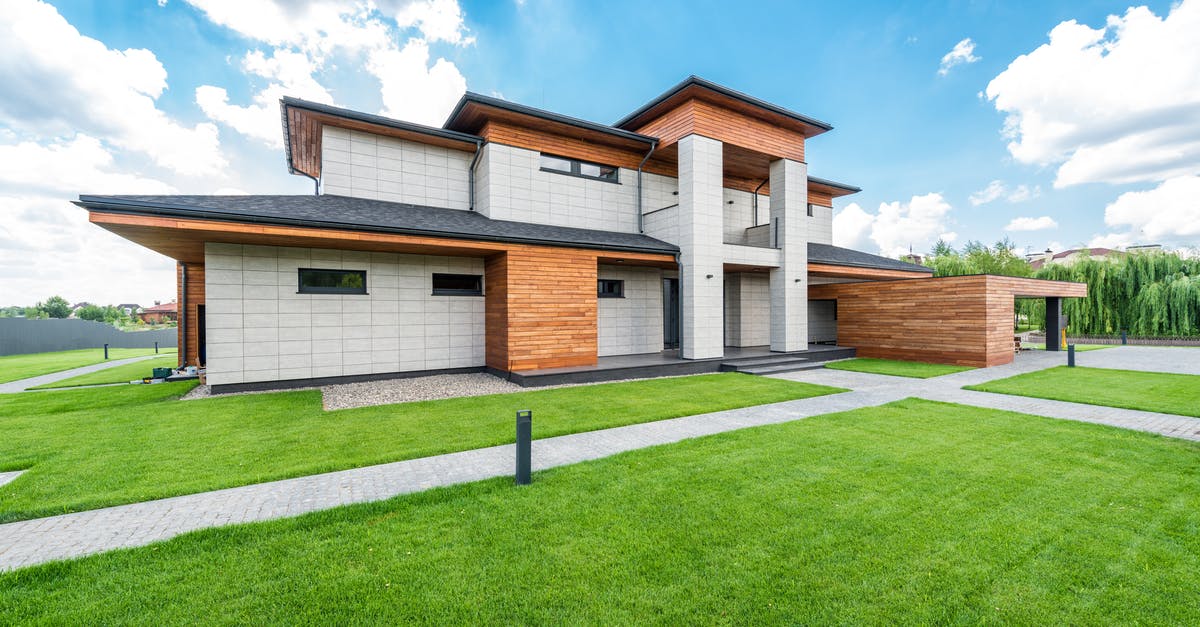 How do I enable Silent Mode? - Exterior of residential house with green trees and lawn growing in countryside in summertime How do I enable Silent Mode? - Exterior of residential house with green trees and lawn growing in countryside in summertime
