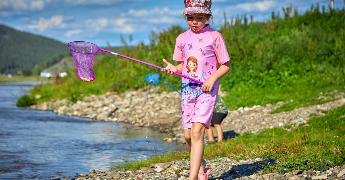 How do I enchant a stick with Knockback 3? [duplicate] - Girl Walking Along the Lakeshore with a Net on a Stick 