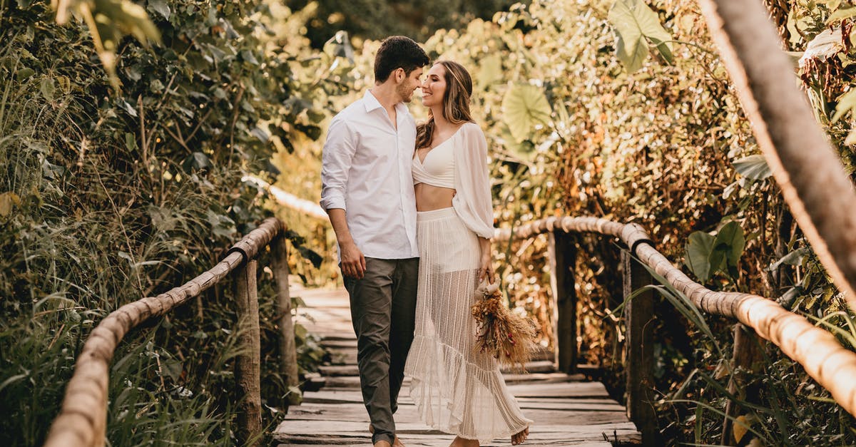 How do I follow a path other than the Atlas path? - Full body of young couple in stylish clothes walking on wooden footbridge and looking at each other while spending time together on summer day How do I follow a path other than the Atlas path? - Full body of young couple in stylish clothes walking on wooden footbridge and looking at each other while spending time together on summer day