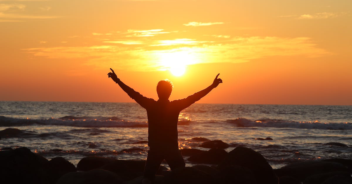 How do I free Giacco? - Man Kneeling on Rocks on Seashore