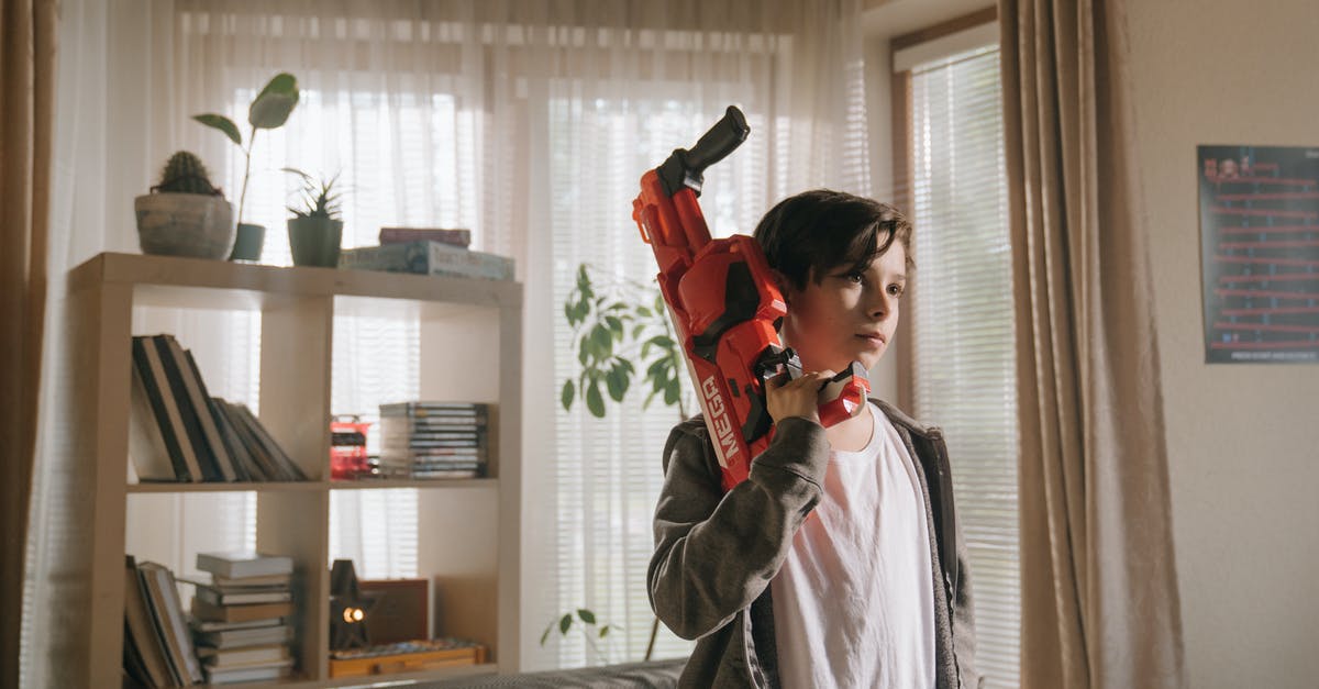 How do I Fulton child soldiers? - Woman in Gray Jacket Holding Red and Black Flashlight How do I Fulton child soldiers? - Woman in Gray Jacket Holding Red and Black Flashlight