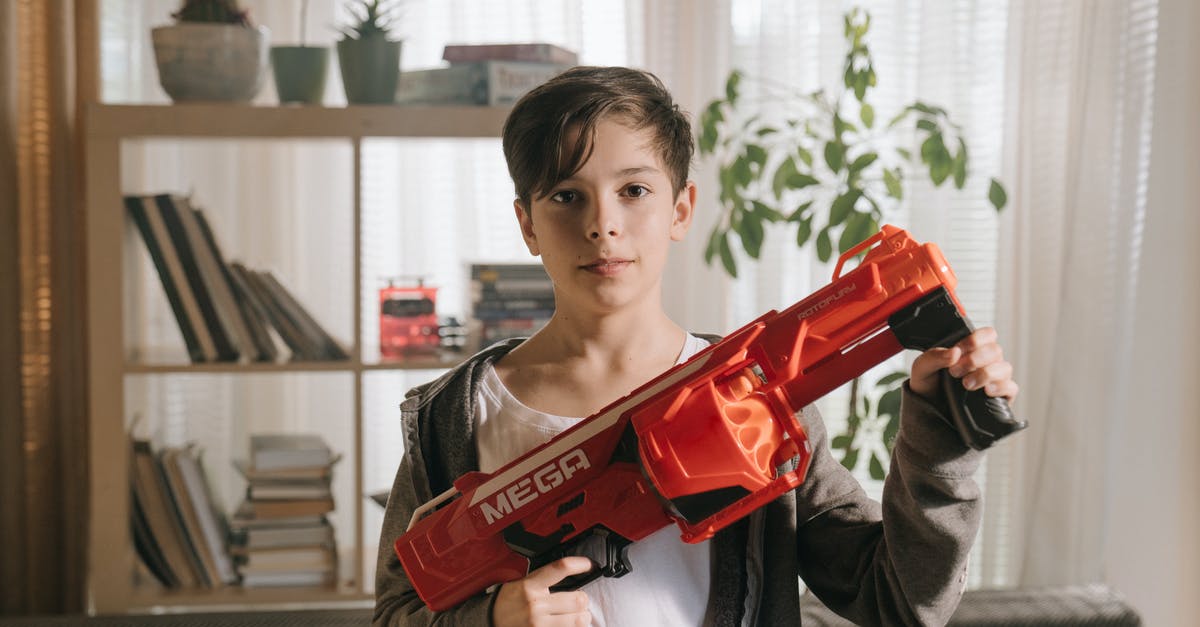 How do I Fulton child soldiers? - Boy in Gray Sweater Holding Red Plastic Toy Gun How do I Fulton child soldiers? - Boy in Gray Sweater Holding Red Plastic Toy Gun