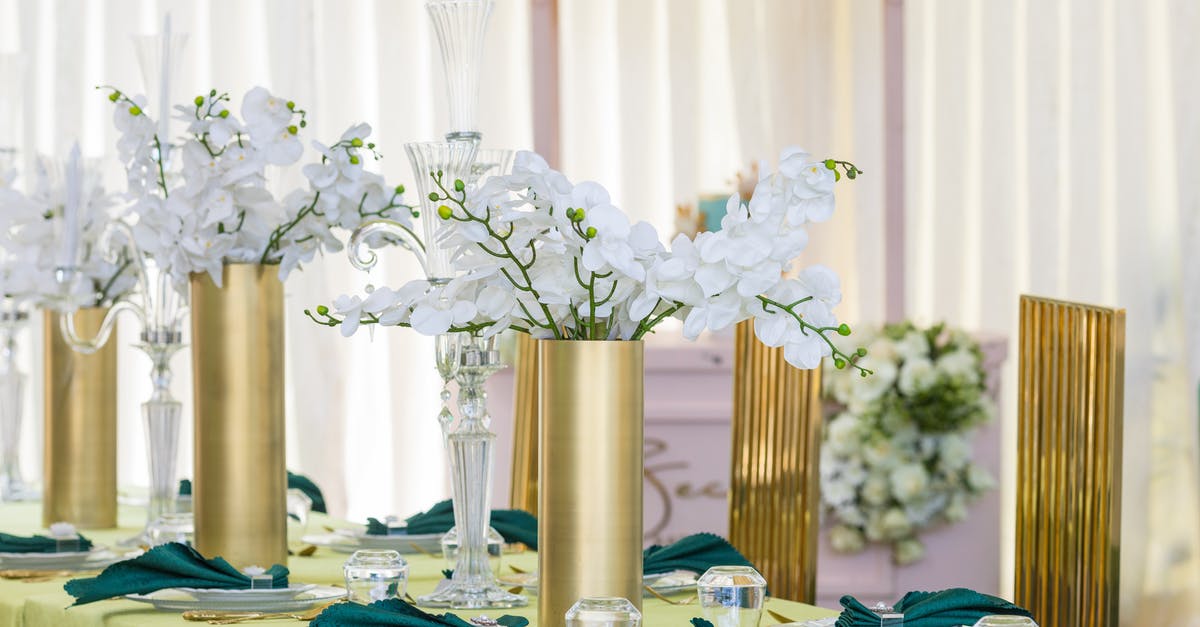 How do I gain gold efficiently? - White Flowers in Gold Vase on Table