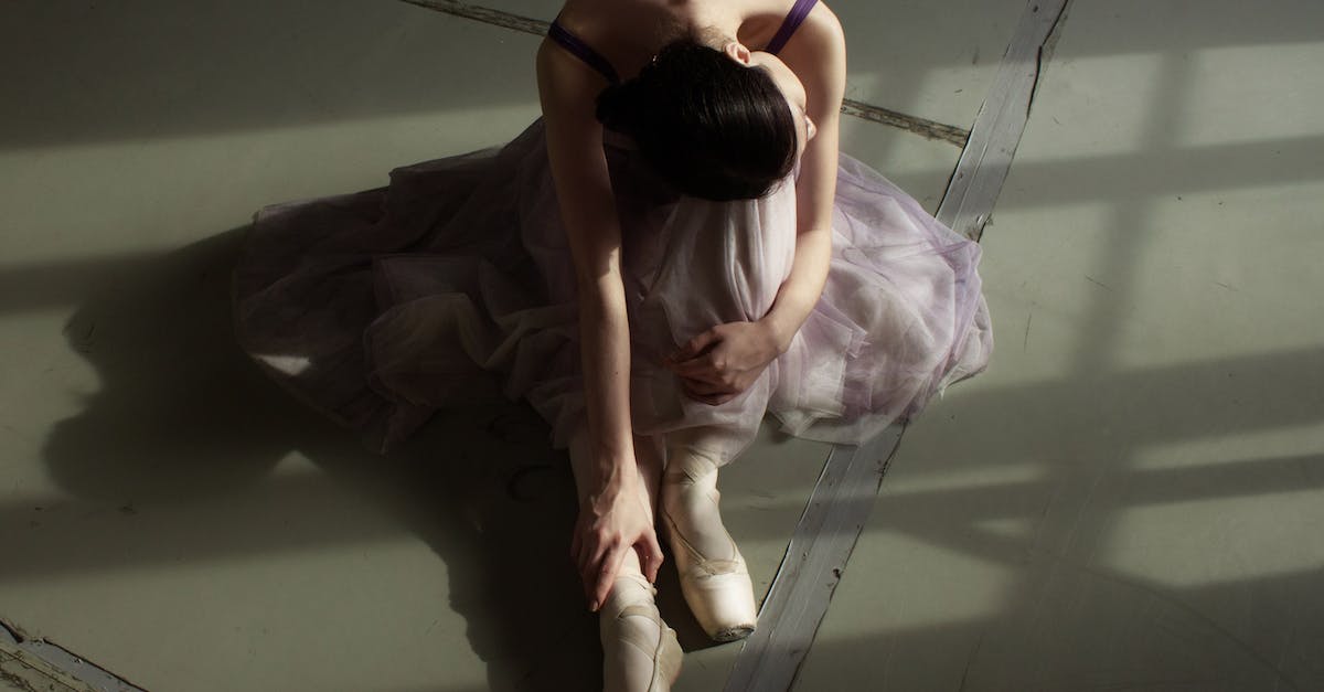 How do I gain skill points from public dungeons? - Unrecognizable graceful ballet dancer resting on floor