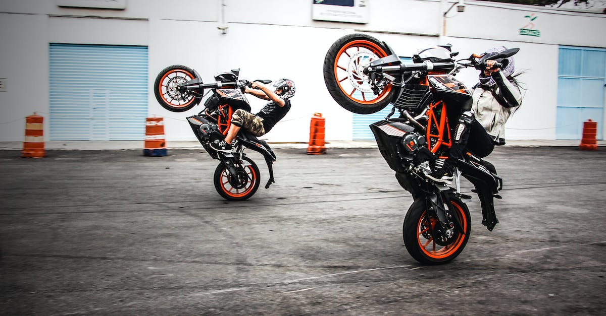 How do I get a lot of Stunt Driver points? - Two Men Riding Orange-and-black Sports Bikes While Doing Exhibition