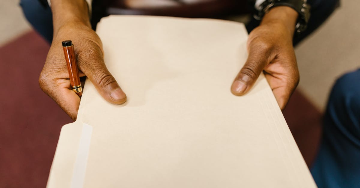 How do I get a .minecraft folder [closed] - Close-Up Shot of a Person Holding a Document