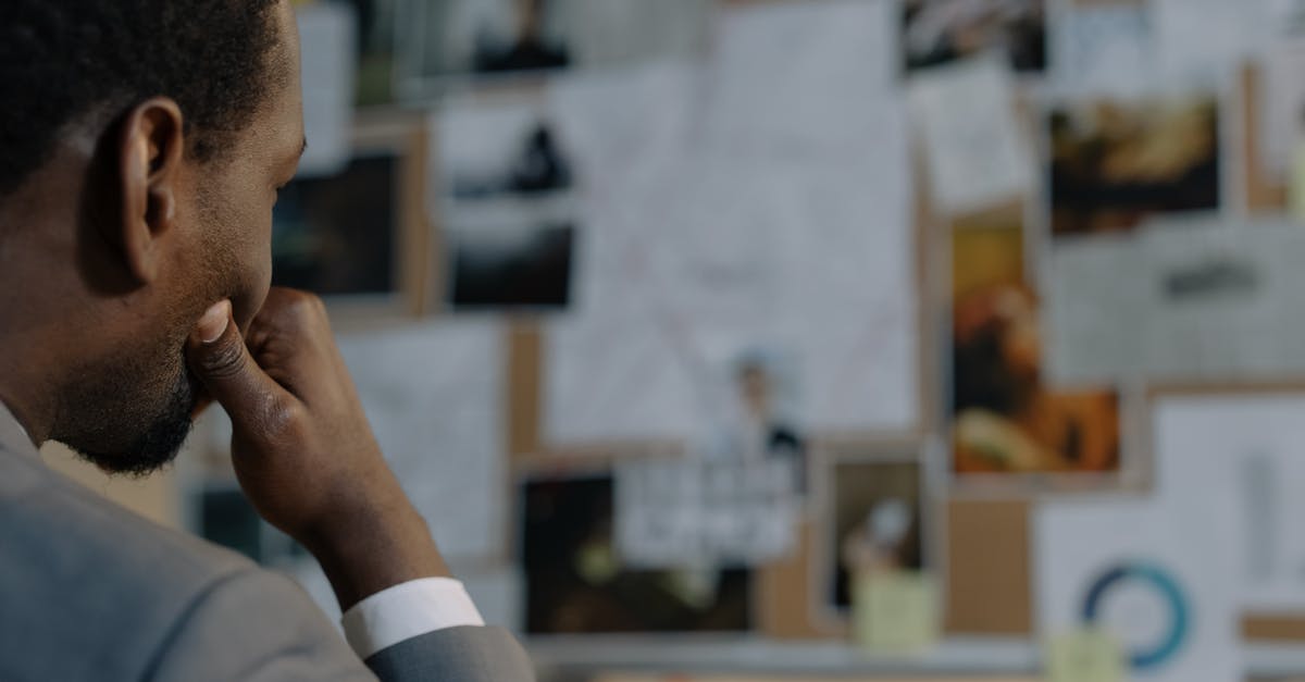 How do I get back to the tavern after being asked to investigate the Cult of Akbaa? - Man in Gray Jacket Looking at the Items on the Wall