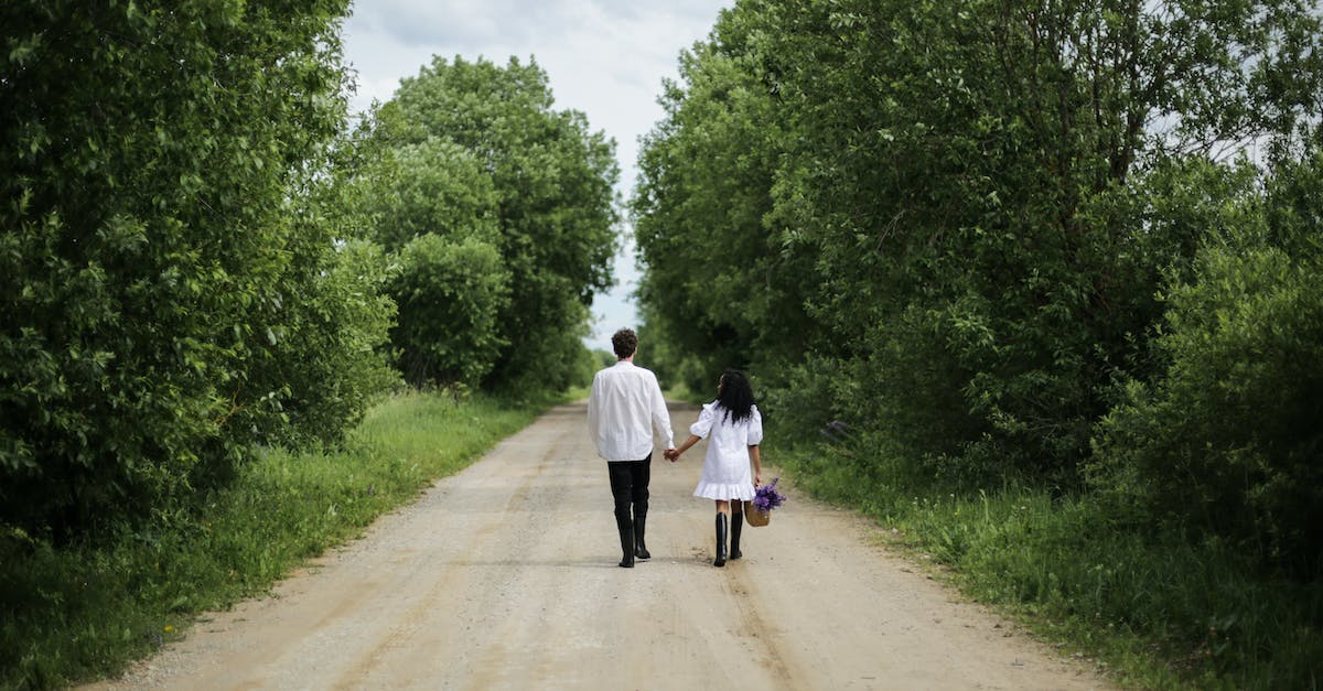 How do I get back to the village without dying? - Woman in White Dress Walking on Road How do I get back to the village without dying? - Woman in White Dress Walking on Road