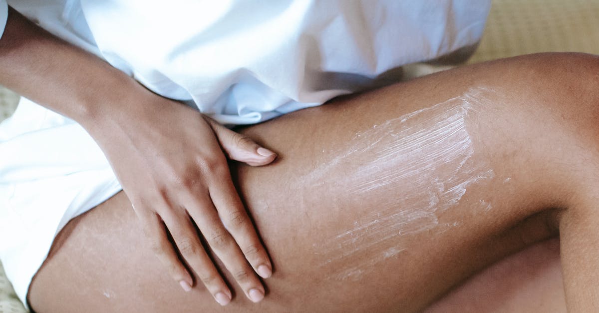 How do I get daily Konami rewards with minimum spoilers/effort? - Woman massaging leg with lotion in bedroom