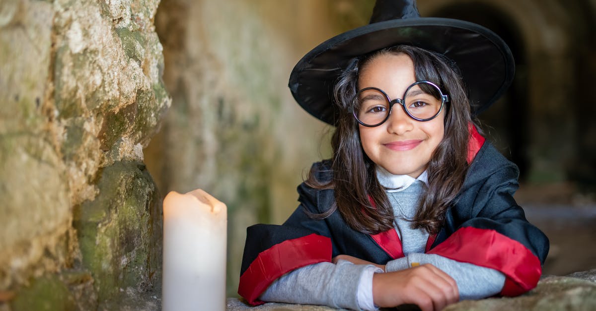 How do I get Dark Characters in Lego Harry Potter? [duplicate] - Woman in Black Hat and Blue Jacket Sitting on Rock