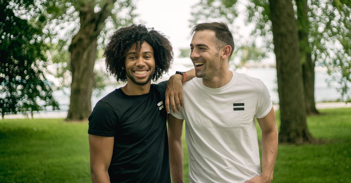 How do I get Friendship Tokens? - Two Men Standing on Grass Field How do I get Friendship Tokens? - Two Men Standing on Grass Field
