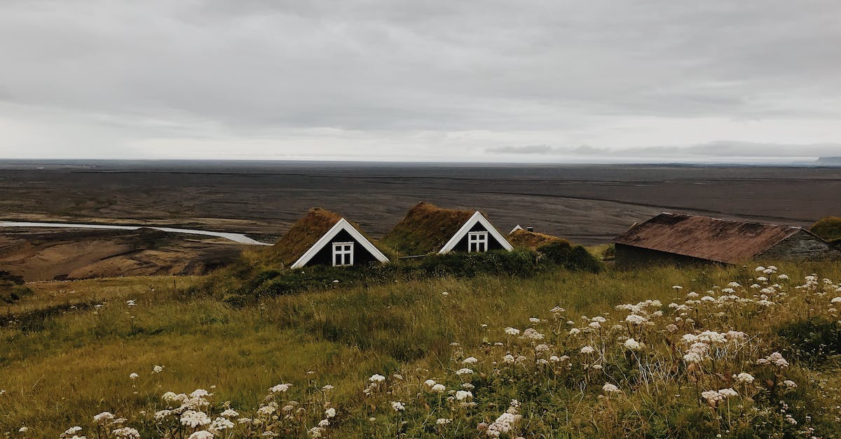 How do I get glass walls without borders? - Wooden Houses in Green Field Under White Skies How do I get glass walls without borders? - Wooden Houses in Green Field Under White Skies