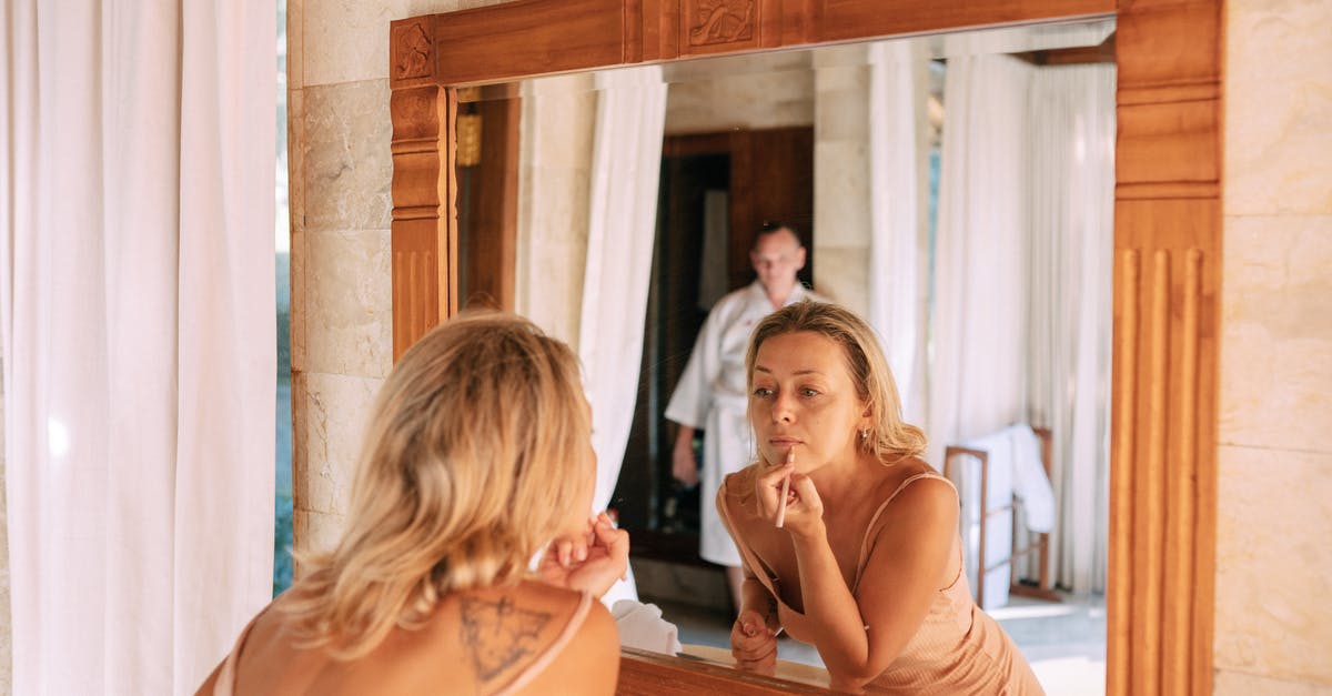 How do I get Medium Debris Pack? - Woman Looking in Mirror in Bathroom Doing Makeup
