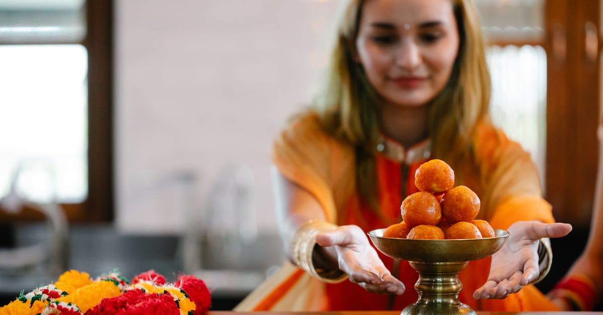 How do I get more Poké Balls with no Poké Stops or Poké Coins? - A Woman Sitting at a Table with Orange Round Shape Food How do I get more Poké Balls with no Poké Stops or Poké Coins? - A Woman Sitting at a Table with Orange Round Shape Food