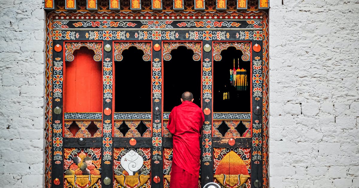 How do I get my building back? - Man in Red Thobe Standing in Front of Red and White Floral Door How do I get my building back? - Man in Red Thobe Standing in Front of Red and White Floral Door