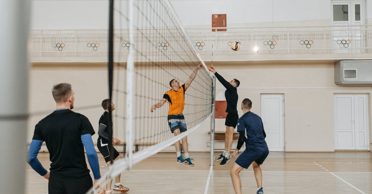 How do I get past players blocking doorways? - Man in Black T-shirt Playing Basketball
