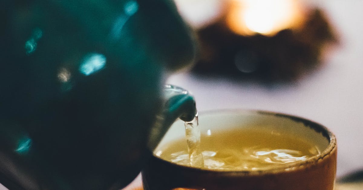 How do I get rid of Tea fields? - Person Pouring Liquid Into Brown Ceramic Cup