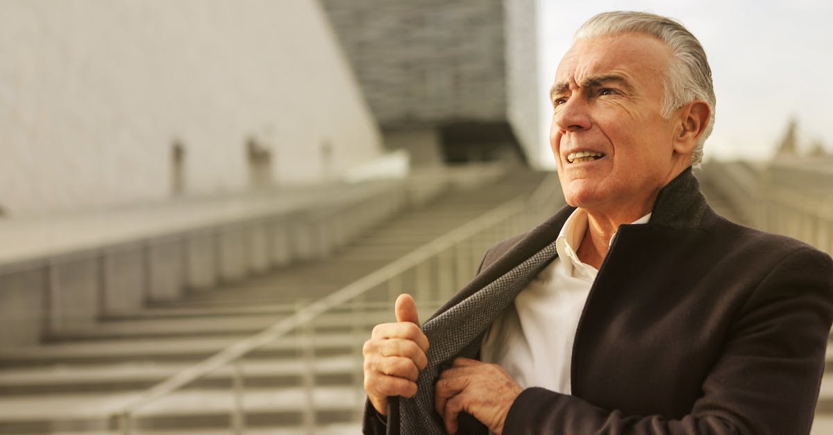 How do I get the achievement "A new you." in the Elder Scrolls 5 Skyrim? - Elderly Man in Black Suit Standing Near Concrete Stairs