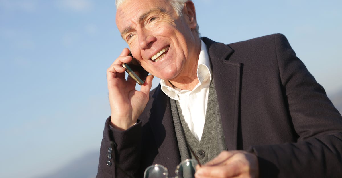How do I get the "Well Informed" Achievement in Cities : Skylines? - Mature businessman having conversation on smartphone in city How do I get the "Well Informed" Achievement in Cities : Skylines? - Mature businessman having conversation on smartphone in city