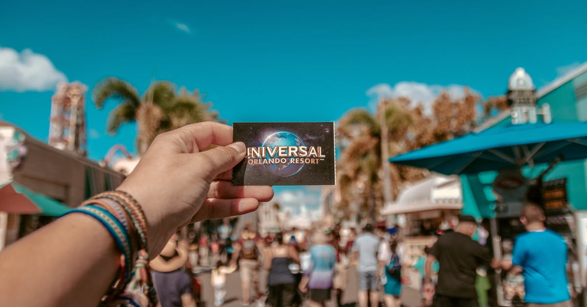 How do I get the ticket in ticket lake? - Person Holding Universal Studios Ticket How do I get the ticket in ticket lake? - Person Holding Universal Studios Ticket