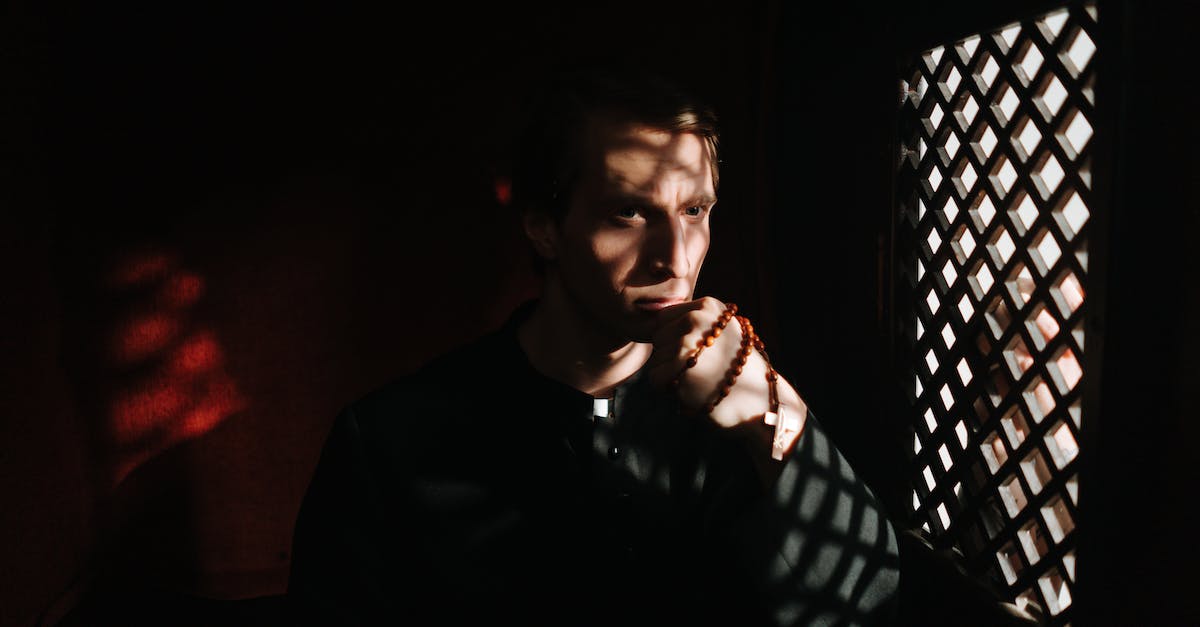 How do I get to the church in tuesday to confess my sins? - Priest Holding a Rosary Inside a Confessional How do I get to the church in tuesday to confess my sins? - Priest Holding a Rosary Inside a Confessional
