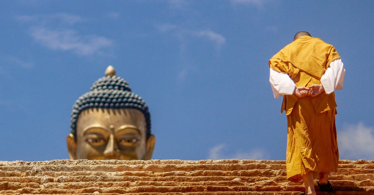How do I go up staircases? - Man Wearing Orange and White Long-sleeved Shirt