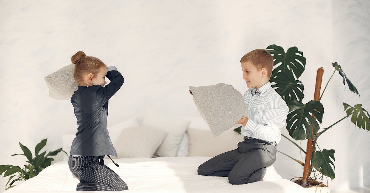 How do I have my king fight in battles? - Happy little business kids having fun together during game with pillows How do I have my king fight in battles? - Happy little business kids having fun together during game with pillows