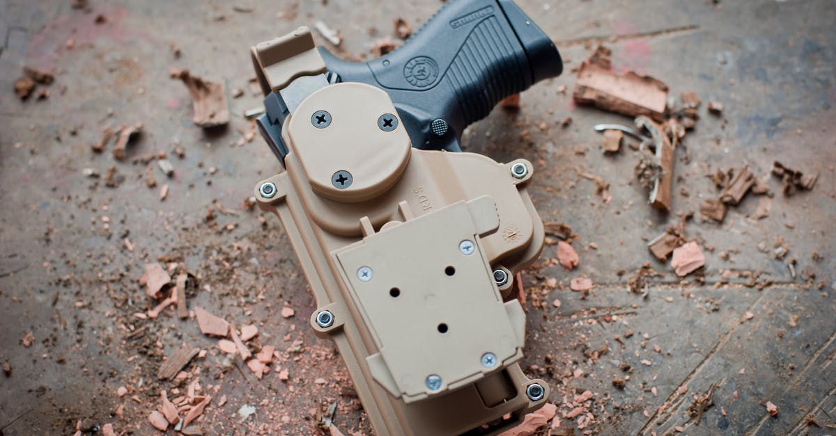 How do I holster weapons? [duplicate] - A Toy Pistol in a Holster