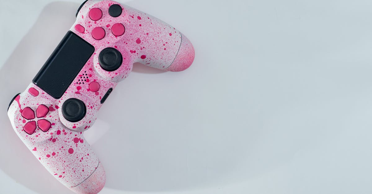 How do I identify a item in Diablo 3 on console? - From above of bright controller with pink drops and knobs with buttons placed on white table while casting shadow in sunny day How do I identify a item in Diablo 3 on console? - From above of bright controller with pink drops and knobs with buttons placed on white table while casting shadow in sunny day