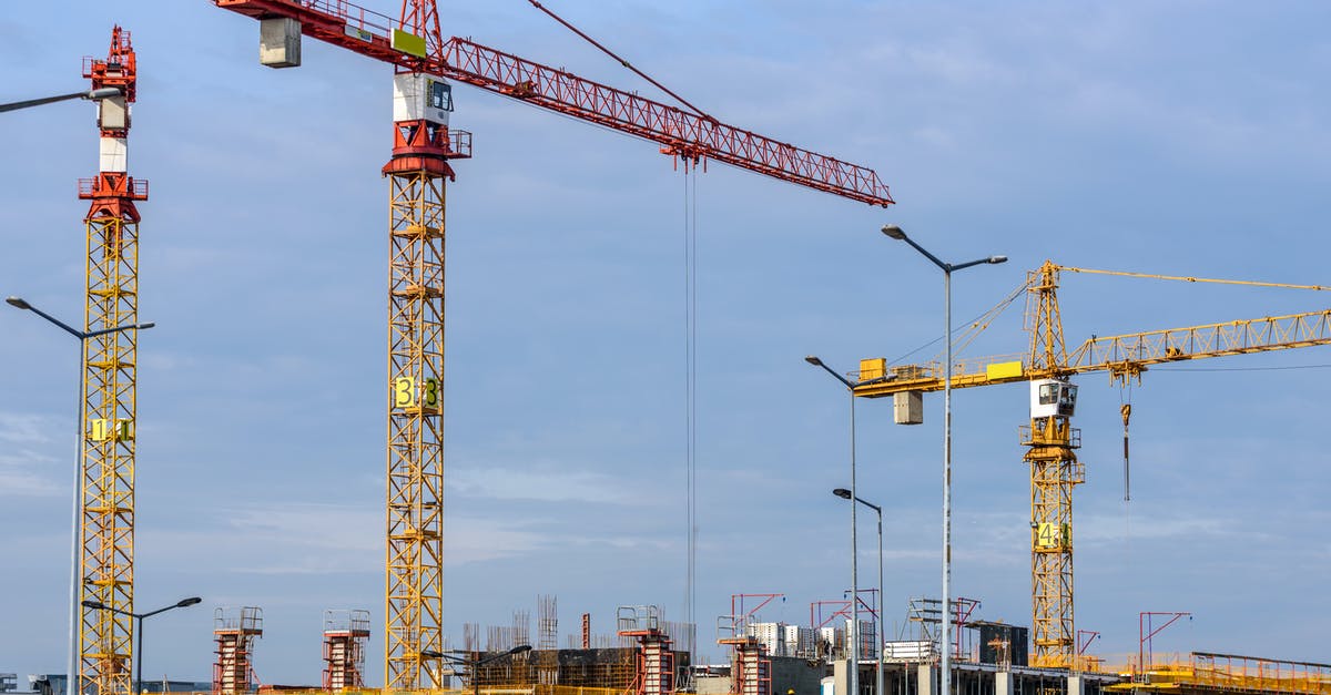 How do I increase the number of workers in an industrial area? - Three Yellow and Red Tower Cranes Under Clear Blue Sky How do I increase the number of workers in an industrial area? - Three Yellow and Red Tower Cranes Under Clear Blue Sky
