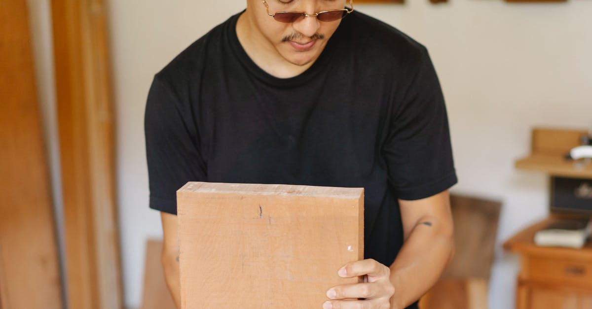 How do I install My custom character in project M? - Crop ethnic focused male in eyeglasses and casual outfit doing carpentry on blurred background of workshop How do I install My custom character in project M? - Crop ethnic focused male in eyeglasses and casual outfit doing carpentry on blurred background of workshop