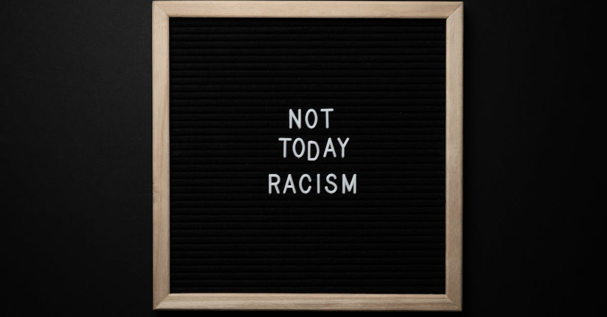 How do I kill the Xinopherydon? - Overhead view of phrase Not Today Racism on square framed signboard on black background