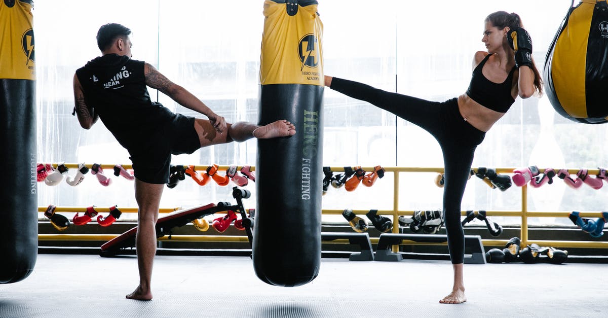 How do I know if my bag is full? - Fit man and woman practicing kickboxing in gym How do I know if my bag is full? - Fit man and woman practicing kickboxing in gym