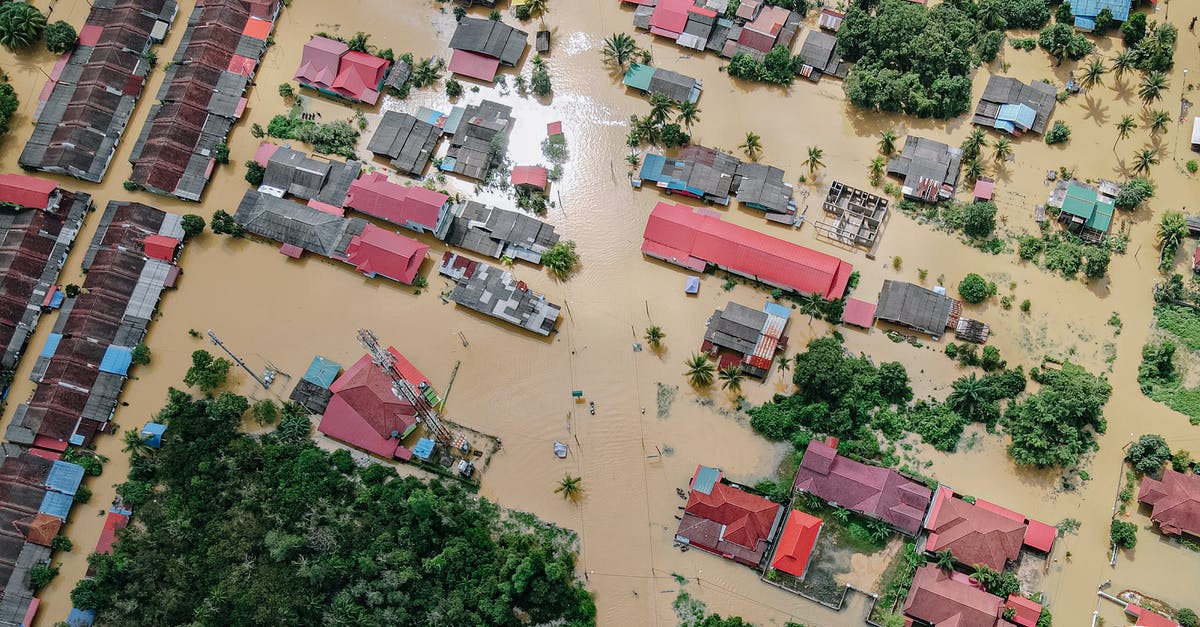How do I make a city recover from a disastrous flood? - Flooded small village with houses How do I make a city recover from a disastrous flood? - Flooded small village with houses