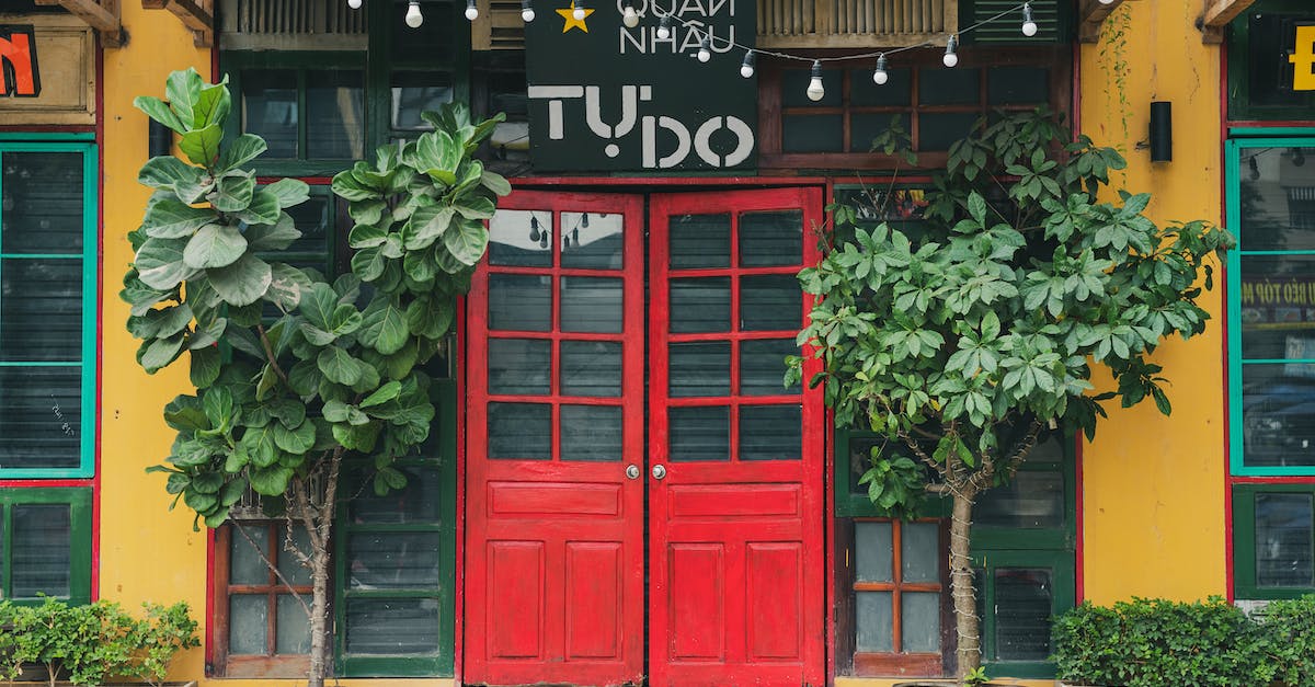 How do I make a day/night automatic double door? [closed] - A  Restaurant with Red Double Doors at the Entrance