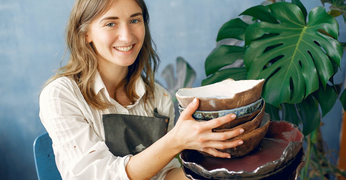 How do I make Minecraft LAN games show up over WiFi? - Positive smiling young craftswoman in white shirt and black apron demonstrating handmade ceramic dishware while sitting near big plant against dark blue wall in modern pottery How do I make Minecraft LAN games show up over WiFi? - Positive smiling young craftswoman in white shirt and black apron demonstrating handmade ceramic dishware while sitting near big plant against dark blue wall in modern pottery