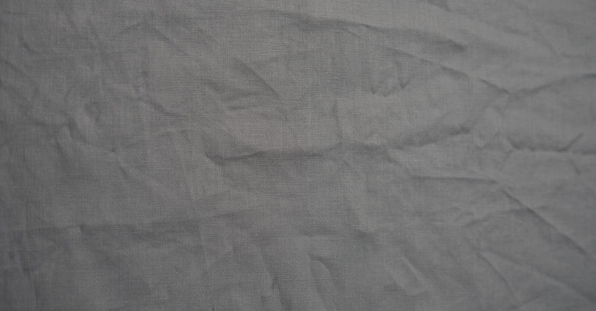 How do I make peace between the Quarians and the Geth? [duplicate] - Gray Textile on Brown Wooden Table