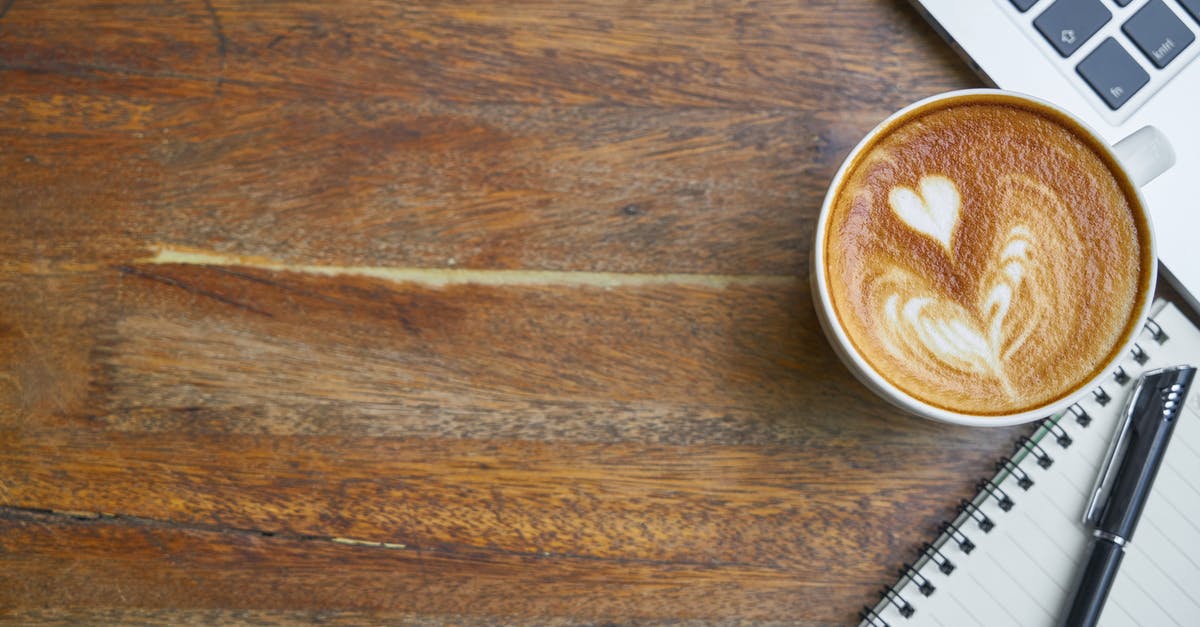 How do I manage leveling up my party? - Cup of fresh cappuccino near laptop keyboard and notebook How do I manage leveling up my party? - Cup of fresh cappuccino near laptop keyboard and notebook