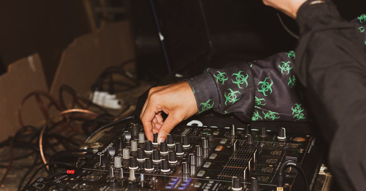 How do I manage leveling up my party? - Crop DJ managing music on music console in studio How do I manage leveling up my party? - Crop DJ managing music on music console in studio