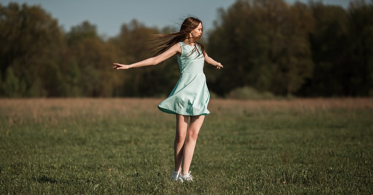 How do I move objects around freely? - Happy young female with long hair in dress spinning around on grassy meadow in countryside How do I move objects around freely? - Happy young female with long hair in dress spinning around on grassy meadow in countryside