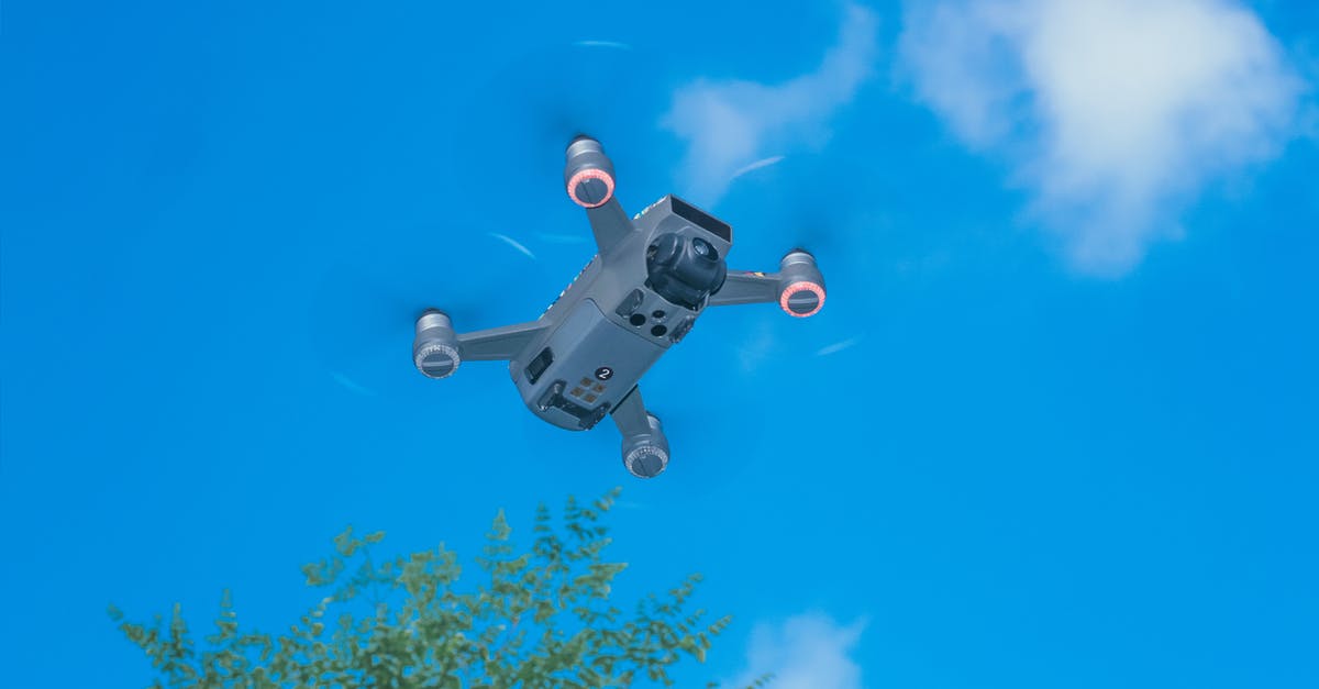 How do I move Terraria progress from one mobile device to another? - From below of modern UAV with photo camera and big propellers flying in sky above forest