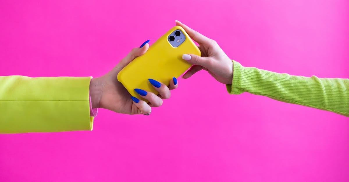 How do I neutralize another hacker? - Unrecognizable Woman Handing Over Mobile Phone to Another Woman How do I neutralize another hacker? - Unrecognizable Woman Handing Over Mobile Phone to Another Woman