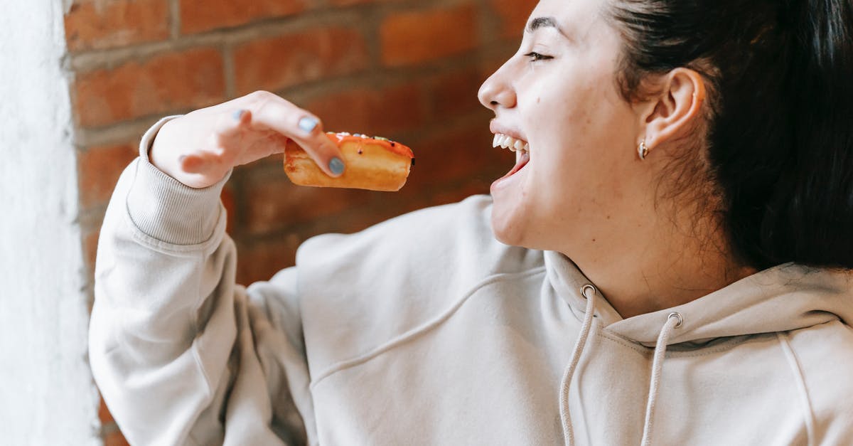How do I open the new dreamy content in Candy Crush? - Crop excited woman eating fresh yummy donut How do I open the new dreamy content in Candy Crush? - Crop excited woman eating fresh yummy donut